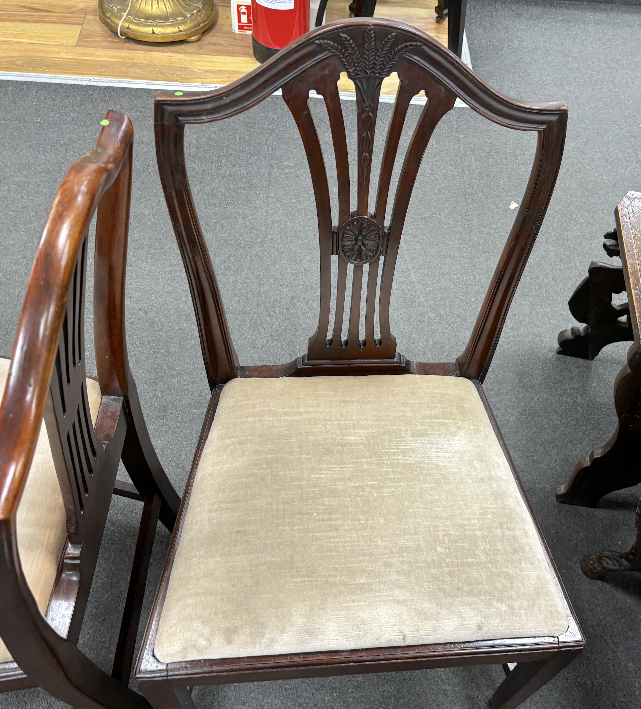 A set of six Hepplewhite style mahogany dining chairs, all singles